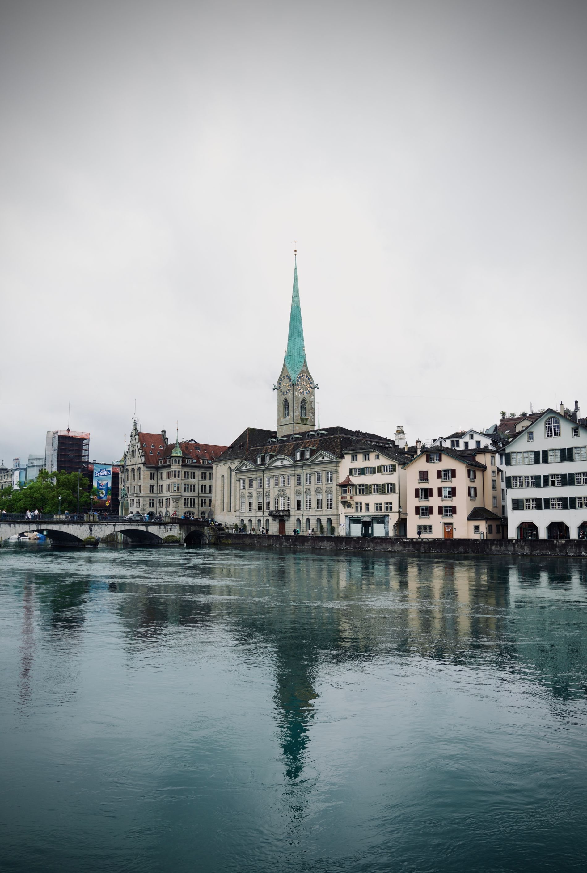 Fraumünster and the Zurich skyline reflected in still water