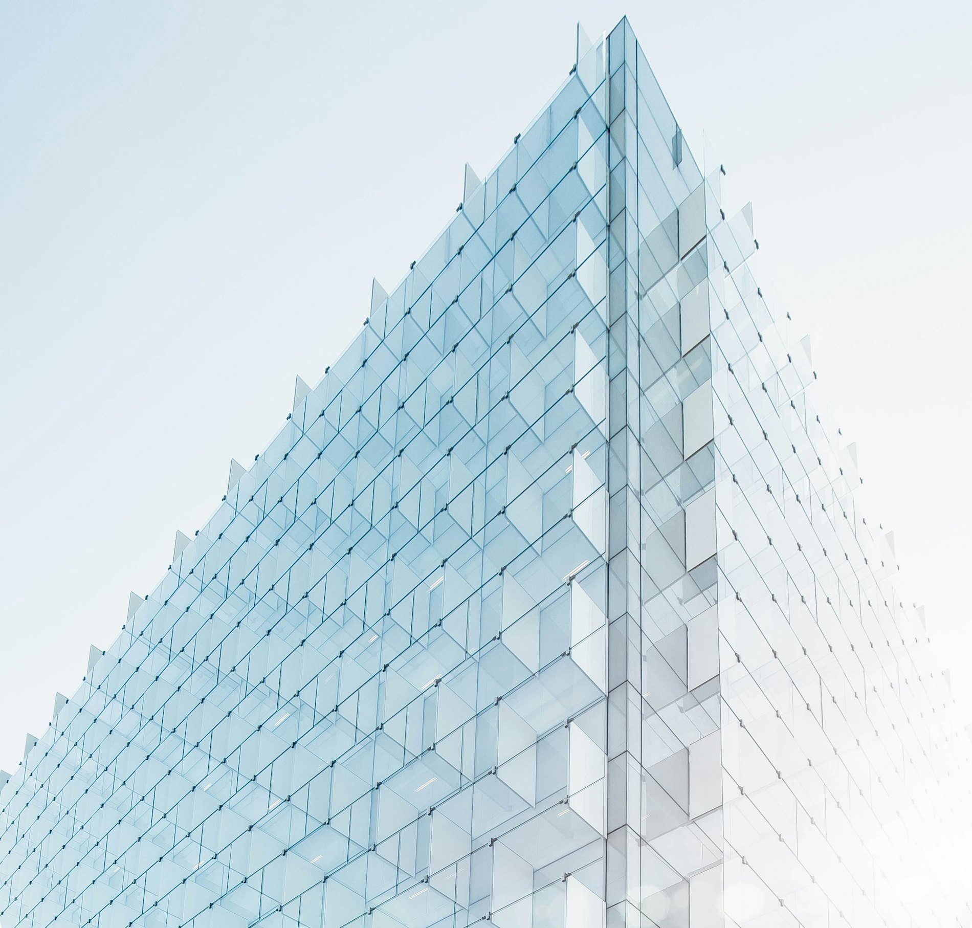 Pale glass facade, repeating grid of panels