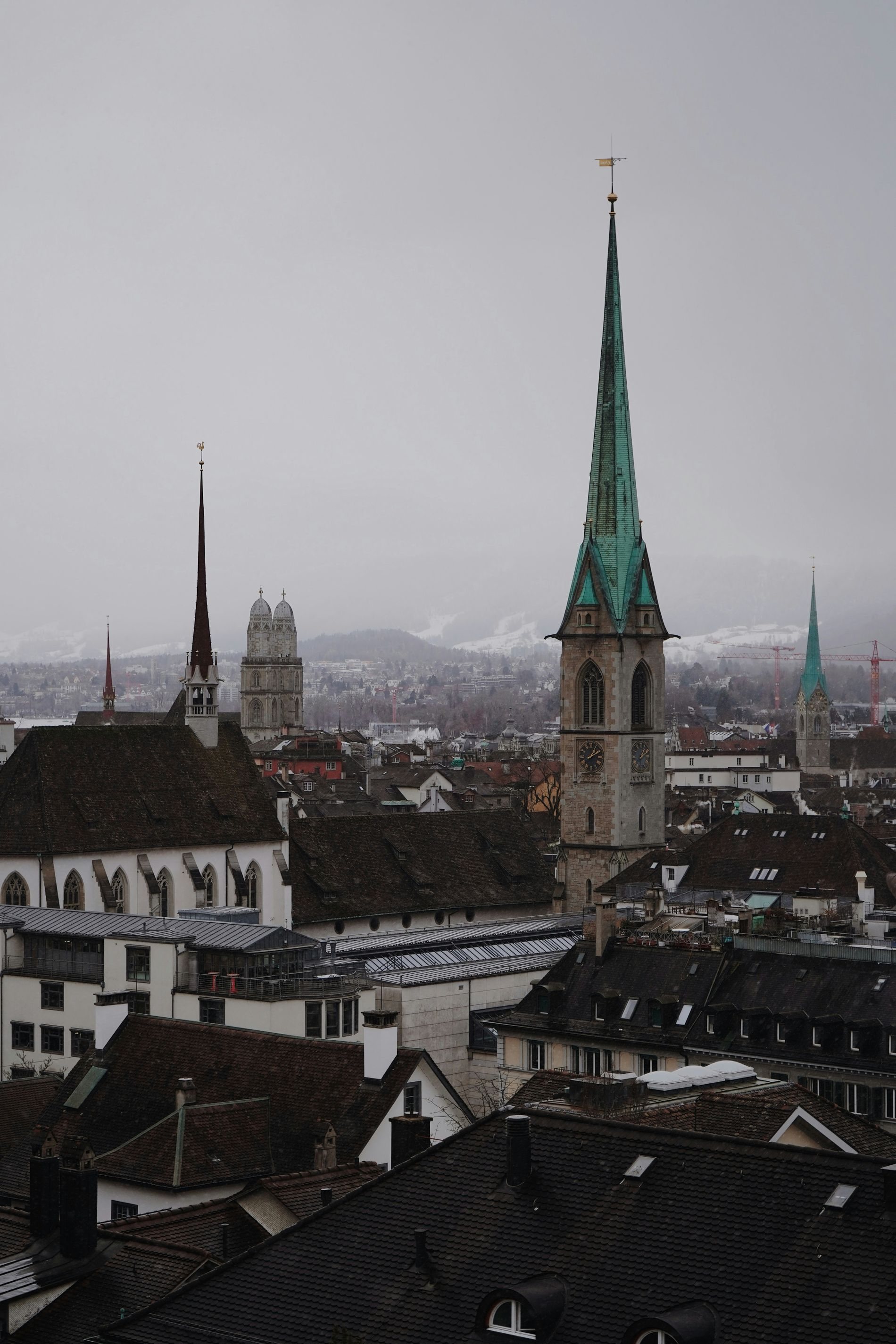 Zurich rooftops and church spires under low cloud
